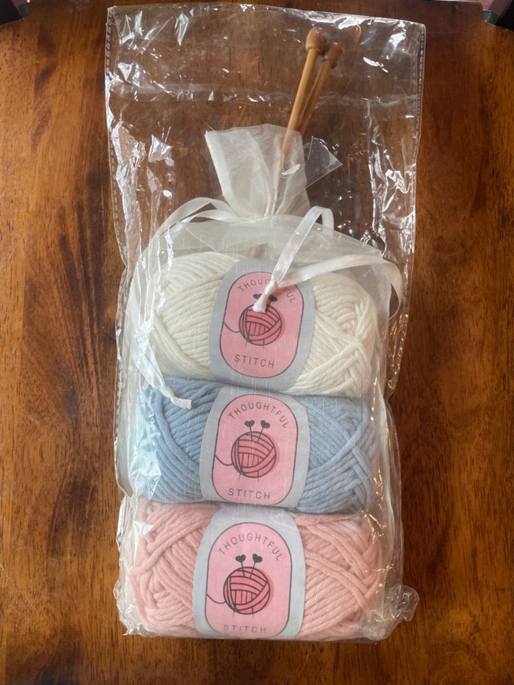 Learn to knit kit that includes Pastel Yarn Gift Set - White, Light Blue, Pink.